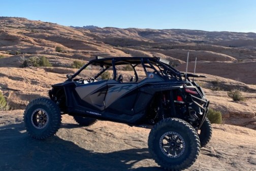 a motorcycle is parked on the side of a mountain